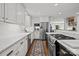 Kitchen with marble counters, stainless steel appliances, and tile backsplash at 311 Mcalway Rd, Charlotte, NC 28211