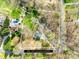An aerial view of the property, showing the boundaries and surrounding greenery and swimming pool at 32 Heritage Ln, Shelby, NC 28150