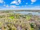 Expansive aerial view of the property, highlighting the surrounding landscape and lake at 32 Heritage Ln, Shelby, NC 28150