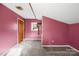 Cozy bedroom with pink walls, plush carpet, and a window offering natural light, perfect for relaxation at 32 Heritage Ln, Shelby, NC 28150