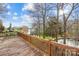 Spacious wooden deck overlooking calm lake waters with scenic trees creating a serene outdoor retreat at 32 Heritage Ln, Shelby, NC 28150