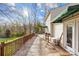Expansive wooden deck with a green awning provides shade and offers a view of the surrounding trees at 32 Heritage Ln, Shelby, NC 28150