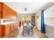 Bright dining room with hardwood floors, wainscotting, and sliding glass doors at 32 Heritage Ln, Shelby, NC 28150
