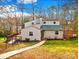 Charming two-story home with a welcoming front yard and a cozy deck, perfect for outdoor relaxation at 32 Heritage Ln, Shelby, NC 28150