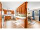 Well-maintained kitchen featuring wooden cabinetry and a functional breakfast bar with sight lines to a dining area at 32 Heritage Ln, Shelby, NC 28150