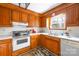 Cozy kitchen with wood cabinets, white countertops, and a view from the window over the sink at 32 Heritage Ln, Shelby, NC 28150