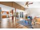 Bright living room featuring hardwood floors, ample natural light, and an open floor plan to the dining area at 32 Heritage Ln, Shelby, NC 28150