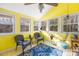 Bright sunroom with natural light beaming through the many windows and high ceilings at 32 Heritage Ln, Shelby, NC 28150