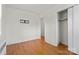 Neutral bedroom featuring hardwood floors, a closet and an ensuite bathroom at 343 Wakefield Dr # C, Charlotte, NC 28209