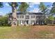 Traditional two-story home featuring gray paint, black shutters, and a well-manicured front lawn at 343 Wakefield Dr # C, Charlotte, NC 28209