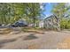 Charming exterior view of property, featuring ample parking and beautiful landscaping in the yard at 343 Wakefield Dr # C, Charlotte, NC 28209