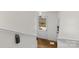 Bright hallway with hardwood floors leading to an exit door for access at 343 Wakefield Dr # C, Charlotte, NC 28209