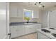 This charming kitchen offers ample counter space, white cabinets, and modern appliances, perfect for home chefs at 343 Wakefield Dr # C, Charlotte, NC 28209