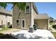 A well-maintained backyard with concrete patio and exterior of home at 346 Cornielle Ln, Charlotte, NC 28216