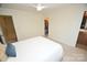 A well-lit bedroom features a walk-in closet, neutral paint, and a doorway to the bathroom at 346 Cornielle Ln, Charlotte, NC 28216