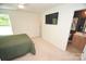 Bright bedroom with large TV, an ensuite bathroom, ceiling fan, neutral paint, and lots of natural light at 346 Cornielle Ln, Charlotte, NC 28216