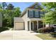Charming two-story home with a manicured front yard and an attached single-car garage at 346 Cornielle Ln, Charlotte, NC 28216