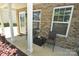 Cozy front porch with seating area and brick accents, perfect for enjoying the outdoors at 346 Cornielle Ln, Charlotte, NC 28216
