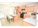 Well-equipped kitchen with stainless steel appliances, granite countertops, kitchen island, and a view to the backyard at 346 Cornielle Ln, Charlotte, NC 28216