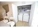 Convenient laundry closet equipped with a washer, dryer, and shelving for storage at 346 Cornielle Ln, Charlotte, NC 28216