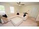 Bright living room featuring a large sectional sofa, ottoman, and neutral decor at 346 Cornielle Ln, Charlotte, NC 28216