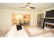 Comfortable living room with a plush white sofa, fireplace, and open view to the dining area at 346 Cornielle Ln, Charlotte, NC 28216