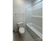 Bathroom features a toilet, tub and shower combination at 4038 Gardenia Dr # 0114, Harrisburg, NC 28075