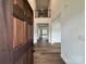 Grand foyer with hardwood floors, an open staircase and a view into the spacious open-concept living area at 4038 Gardenia Dr # 0114, Harrisburg, NC 28075