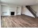 Spacious living room features a fireplace, built-in shelving, and hardwood floors at 4038 Gardenia Dr # 0114, Harrisburg, NC 28075
