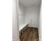 Mudroom features a built-in bench with coat hooks and backyard access door at 4038 Gardenia Dr # 0114, Harrisburg, NC 28075
