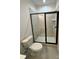 Bathroom featuring glass-enclosed shower and toilet at 4038 Gardenia Dr # 0114, Harrisburg, NC 28075
