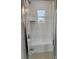 Glass enclosed shower with built-in bench and white subway tile at 4038 Gardenia Dr # 0114, Harrisburg, NC 28075
