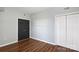 This bedroom features wood floors, neutral gray walls, and a closet at 405 W 7Th St # 408, Charlotte, NC 28202