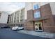 Beautiful brick apartment building exterior with covered entrance and parking at 405 W 7Th St # 408, Charlotte, NC 28202