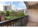 Balcony view overlooking a park with the Charlotte skyline as a backdrop, showcasing urban living at 405 W 7Th St # 408, Charlotte, NC 28202