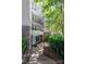 Exterior building entrance with rounded balconies and professional landscaping at 405 W 7Th St # 408, Charlotte, NC 28202