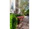 Exterior facade with manicured landscaping and private balconies at 405 W 7Th St # 408, Charlotte, NC 28202