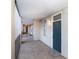 Apartment hallway with gray walls and a door to a unit on the right at 405 W 7Th St # 408, Charlotte, NC 28202