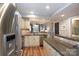 Bright kitchen with stainless steel appliances and view into the living area, enhancing connectivity at 405 W 7Th St # 408, Charlotte, NC 28202