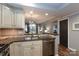 Open kitchen with granite countertops, stainless steel appliances, and a view to the living room at 405 W 7Th St # 408, Charlotte, NC 28202