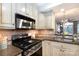 Modern kitchen featuring granite countertops, stainless steel appliances, and custom cabinets at 405 W 7Th St # 408, Charlotte, NC 28202