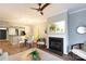 Open-concept living room with dining area, fireplace, and modern decor at 405 W 7Th St # 408, Charlotte, NC 28202