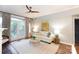 Bright living room featuring hardwood floors, fireplace, and large windows at 405 W 7Th St # 408, Charlotte, NC 28202