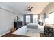Bright main bedroom with hardwood floors, ample natural light, and walk-in closet at 405 W 7Th St # 408, Charlotte, NC 28202