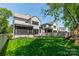 This spacious backyard features a well-maintained lawn, patio, firepit, and a fenced yard with plenty of room to relax at 410 Mcalway Rd, Charlotte, NC 28211