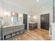 Elegant bathroom featuring double vanities, hardwood floors, and modern fixtures with lots of storage at 410 Mcalway Rd, Charlotte, NC 28211