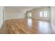 A large, versatile bonus room with hardwood floors and large windows for ample natural light at 410 Mcalway Rd, Charlotte, NC 28211