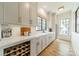 Charming butler's pantry with a wine rack, cabinets, sink, and ample counter space for serving at 410 Mcalway Rd, Charlotte, NC 28211