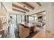 Stylish dining room featuring a wooden table, upholstered chairs, natural light, and a view into the living room at 410 Mcalway Rd, Charlotte, NC 28211
