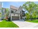 Stunning two-story home with a clean, modern exterior, manicured lawn, and an inviting driveway at 410 Mcalway Rd, Charlotte, NC 28211